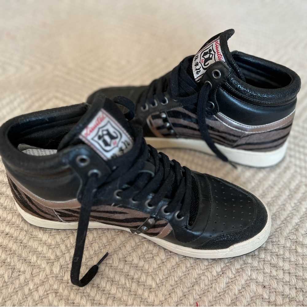Women’s Ash high top sneakers. Black w calf hair animal print and studs. NWT.